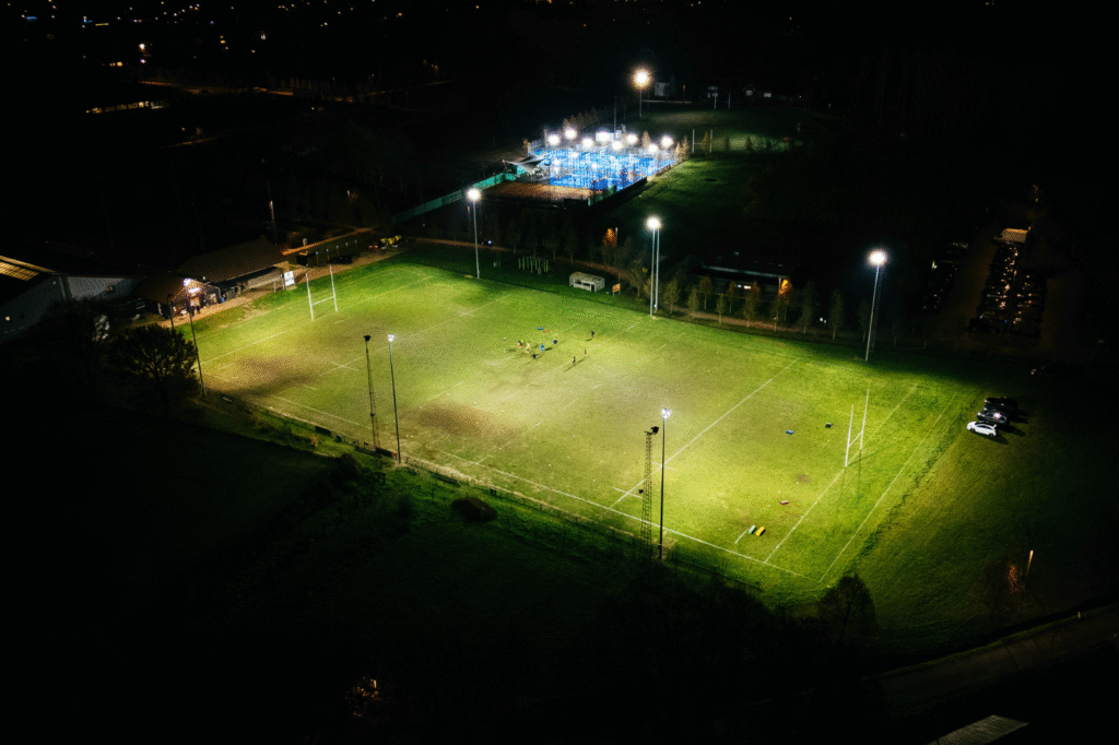 Rugby field illuminated with powerful LED sports lighting for safe and comfortable training in the dark