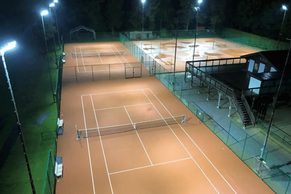 Evening view of tennis complex with LED lighting tennis courts according to lux standards
